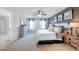 A spacious main bedroom with en-suite bathroom, dresser, and framed wall art at 174 Aster Avenue, Locust Grove, GA 30248