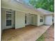 Covered back patio with a concrete floor, great for outdoor entertaining at 25 Pebble Creek Dr, Covington, GA 30016