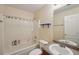 Functional bathroom featuring a shower-tub combo, toilet, and vanity with sink for everyday convenience at 25 Pebble Creek Dr, Covington, GA 30016