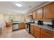 Well-lit kitchen with stainless steel appliances and a view into the adjacent dining room at 25 Pebble Creek Dr, Covington, GA 30016