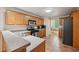 Modern kitchen with stainless steel appliances, tile flooring, and ample counter space at 25 Pebble Creek Dr, Covington, GA 30016