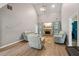 Bright and airy living room includes a fireplace, vaulted ceilings, and hardwood floors at 25 Pebble Creek Dr, Covington, GA 30016
