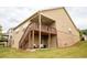 Expansive backyard with a deck, stairs, mature trees, and well-maintained lawn at 2665 Crowbrook Way, Cumming, GA 30040
