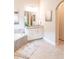 Bright bathroom with a soaking tub, white cabinets, and granite countertops at 2665 Crowbrook Way, Cumming, GA 30040