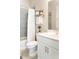 Bathroom with vanity, toilet and grey tile shower with white curtain at 2665 Crowbrook Way, Cumming, GA 30040