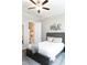 Bedroom with ceiling fan and view of ensuite bathroom at 2665 Crowbrook Way, Cumming, GA 30040
