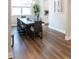 Open dining area with wood floors, modern light fixture, and large windows at 2665 Crowbrook Way, Cumming, GA 30040