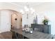Elegant dining room with a modern chandelier, stylish decor, and a large dining table at 2665 Crowbrook Way, Cumming, GA 30040