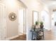 Bright hallway with decorative elements, arched doorways, and hardwood floors at 2665 Crowbrook Way, Cumming, GA 30040