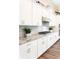 Modern kitchen featuring granite countertops, stainless steel appliances, and white cabinetry at 2665 Crowbrook Way, Cumming, GA 30040