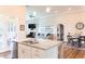 Modern kitchen with a granite island countertop, stainless steel appliances, and an open floor plan at 2665 Crowbrook Way, Cumming, GA 30040