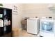 Well-equipped laundry room featuring a front loading washer and dryer at 2665 Crowbrook Way, Cumming, GA 30040