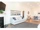 Open concept living room featuring gray sofa and hardwood floors at 2665 Crowbrook Way, Cumming, GA 30040