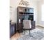 Stylish home office with a built-in desk, cozy rug, and natural light at 2665 Crowbrook Way, Cumming, GA 30040
