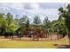 A charming playground in a secure fenced area, offering a fun and safe recreational space for children at 2665 Crowbrook Way, Cumming, GA 30040