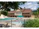 Inviting community pool and clubhouse featuring an array of lounge chairs and outdoor spaces at 2665 Crowbrook Way, Cumming, GA 30040