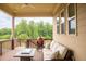Inviting porch with comfortable seating, an outdoor grill, and scenic views at 2665 Crowbrook Way, Cumming, GA 30040