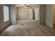 Spacious bedroom with neutral carpet, ceiling fan, and light gray walls offers a serene retreat at 85 Holly Dr, Carrollton, GA 30116
