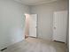 Bedroom with neutral carpet, and two doors at 85 Holly Dr, Carrollton, GA 30116
