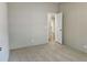 Bedroom featuring neutral carpet, light grey walls, and an open entry to a walk-in closet at 85 Holly Dr, Carrollton, GA 30116