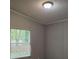 Cozy bedroom features a window with blinds and neutral paint at 85 Holly Dr, Carrollton, GA 30116