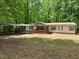 Home exterior with carport and front porch at 85 Holly Dr, Carrollton, GA 30116