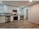 Modern kitchen featuring stainless steel appliances, granite countertops, and white cabinets at 85 Holly Dr, Carrollton, GA 30116
