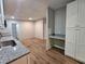 Bright kitchen features white cabinets, granite countertops, and stainless steel appliances at 85 Holly Dr, Carrollton, GA 30116