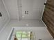 Laundry room with new vinyl floors and shelving at 85 Holly Dr, Carrollton, GA 30116