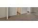 Bright living room boasts plush carpeting and neutral colors creating an inviting and comfortable atmosphere at 85 Holly Dr, Carrollton, GA 30116