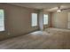 Spacious living room with neutral carpet offers an inviting and comfortable atmosphere at 85 Holly Dr, Carrollton, GA 30116