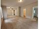 Spacious main bedroom with a ceiling fan, walk-in closet, and en-suite bathroom at 85 Holly Dr, Carrollton, GA 30116