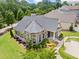 Aerial view of a well-maintained home with manicured lawns and mature landscaping in a quiet neighborhood at 307 Serenity Way, Woodstock, GA 30188