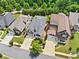 Beautiful neighborhood featuring manicured lawns and mature trees surrounding well-maintained homes at 307 Serenity Way, Woodstock, GA 30188