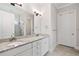 Bathroom featuring a double sink vanity, granite countertops, and tiled floors, with a tiled shower at 307 Serenity Way, Woodstock, GA 30188