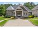 Community clubhouse featuring professional landscaping and designated handicap parking at 307 Serenity Way, Woodstock, GA 30188