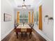 Bright dining room featuring a long table and large windows with sunny views at 307 Serenity Way, Woodstock, GA 30188