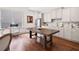 Bright kitchen with stainless steel appliances, white cabinetry and large center island at 307 Serenity Way, Woodstock, GA 30188