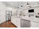 Spacious kitchen featuring stainless steel appliances, a granite countertop, and a central island at 307 Serenity Way, Woodstock, GA 30188