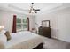 Spacious main bedroom with a queen-size bed, a large window, and a dresser with mirror at 307 Serenity Way, Woodstock, GA 30188