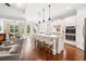 Beautiful open concept kitchen and living area with hardwood floors and stainless appliances at 307 Serenity Way, Woodstock, GA 30188