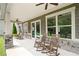 Covered porch with rocking chairs and stone pillars offers a relaxing outdoor space at 307 Serenity Way, Woodstock, GA 30188