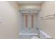 A clean bathroom with a tub, toilet, and neutral walls creates a relaxing space at 346 Carpenter Dr # 70, Atlanta, GA 30328