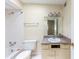 Functional bathroom with a toilet, sink, mirror, and shower-tub combination at 346 Carpenter Dr # 70, Atlanta, GA 30328
