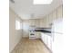 Bright kitchen featuring white cabinets and appliances, offering a clean, functional space at 346 Carpenter Dr # 70, Atlanta, GA 30328