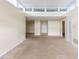 A spacious living room with neutral tones boasts a large doorway and an entry door at 346 Carpenter Dr # 70, Atlanta, GA 30328