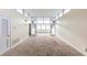 Bright living room with large windows and neutral carpet offers plenty of natural light at 346 Carpenter Dr # 70, Atlanta, GA 30328