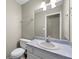 Cozy bathroom with single sink vanity and neutral-colored walls at 470 Piney Sw Way, Atlanta, GA 30331
