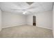 This cozy bedroom features neutral carpeting, a ceiling fan, and ample space at 470 Piney Sw Way, Atlanta, GA 30331