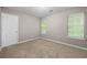 Bedroom with two windows, carpet, and a neutral color palette at 470 Piney Sw Way, Atlanta, GA 30331